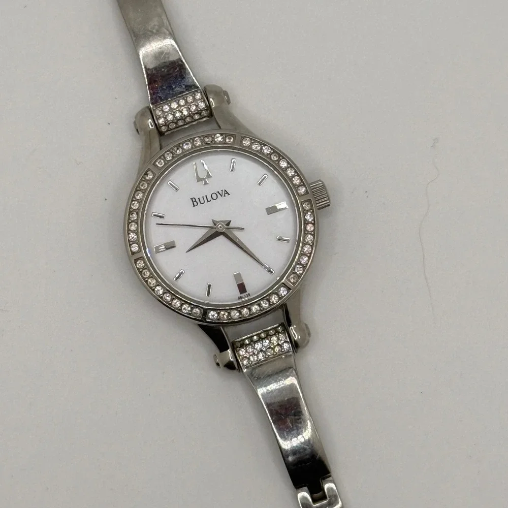 Bulova‎ Women Silver Tone Crystal Bezel White Dial Bangle Watch C869915 READ